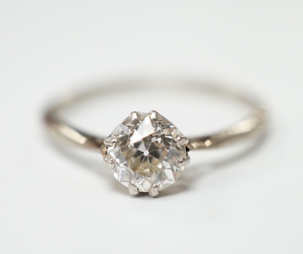 A white metal and solitaire diamond set ring, size O/P, gross weight 2.4 grams